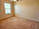 Neutral bedroom with plush carpeting, a window, and standard electrical outlets at 5088 Wavering Place Loop, Myrtle Beach, SC 29579