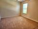 Bedroom with neutral carpeting, a window, and standard electrical outlets at 5088 Wavering Place Loop, Myrtle Beach, SC 29579