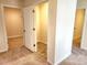 Hallway featuring multiple doorways and neutral carpeting at 5088 Wavering Place Loop, Myrtle Beach, SC 29579