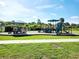 Playground featuring slides, climbing structures, and shaded areas, designed for outdoor recreation at 5088 Wavering Place Loop, Myrtle Beach, SC 29579