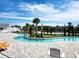 A long winding pool that twists around plants with bridges to cross and lounge chairs on the deck at 5088 Wavering Place Loop, Myrtle Beach, SC 29579