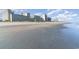 Expansive sandy beach meets the ocean and resort buildings at 5300 N Ocean Blvd. # 217, Myrtle Beach, SC 29577