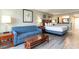 Relaxing bedroom featuring a comfortable sofa, queen-sized bed, and tasteful decor at 5300 N Ocean Blvd. # 217, Myrtle Beach, SC 29577