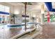 Indoor pool with lazy river, palm trees and decorative painting for a fun experience at 5300 N Ocean Blvd. # 217, Myrtle Beach, SC 29577