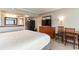 Inviting bedroom featuring a full kitchen, a flat-screen TV, and comfortable bed at 5300 N Ocean Blvd. # 217, Myrtle Beach, SC 29577