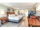 Open-concept bedroom with a comfortable bed, living area, a kitchen, and modern décor at 5300 N Ocean Blvd. # 217, Myrtle Beach, SC 29577