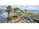 Relaxing pool area with palm trees, lounge chairs, beach access and outdoor seating at 5300 N Ocean Blvd. # 217, Myrtle Beach, SC 29577