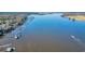 A vast river view showcasing multiple docks along the water with boats and a fast moving wave runner at 100 Deloach Trail, Pawleys Island, SC 29585