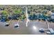 Aerial view of a boat ramp with docks along a river with homes on either side at 100 Deloach Trail, Pawleys Island, SC 29585