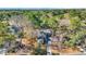 Aerial view of a brick home on a wooded lot with a long driveway at 100 Deloach Trail, Pawleys Island, SC 29585