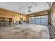 Spacious garage with concrete floors, pegboard walls, shelving, and a rolling door at 100 Deloach Trail, Pawleys Island, SC 29585