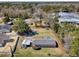 Aerial view of a home with a spacious lot and surrounded by trees at 107 Ben Horry Trail, Pawleys Island, SC 29585