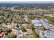 Community aerial with a mix of residential and commercial properties surrounded by mature trees at 107 Ben Horry Trail, Pawleys Island, SC 29585