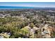 Picturesque aerial view of the community with mature trees, ocean backdrop at 107 Ben Horry Trail, Pawleys Island, SC 29585