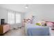 Kid-friendly bedroom with charming details, featuring light filled windows and hardwood floors at 107 Ben Horry Trail, Pawleys Island, SC 29585