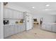 Spacious kitchen showcasing gray cabinets and wood-look floors at 107 Ben Horry Trail, Pawleys Island, SC 29585