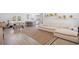 Open-concept living area with a large sectional couch and seamless flow to the kitchen at 107 Ben Horry Trail, Pawleys Island, SC 29585