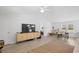 Bright living room with a ceiling fan, seamlessly connected to the dining area and bedroom at 107 Ben Horry Trail, Pawleys Island, SC 29585