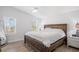 A view of the main bedroom with vaulted ceilings and large windows at 107 Ben Horry Trail, Pawleys Island, SC 29585