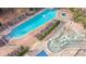 Aerial view of a community pool and splash pad with plenty of lounge chairs for relaxing at 107 S Ocean Blvd. # 704, Myrtle Beach, SC 29577