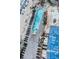 Aerial view of outdoor pool and lounge area adjacent to the beach, complete with a splash area at 107 S Ocean Blvd. # 704, Myrtle Beach, SC 29577