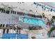 Aerial view of outdoor pool and lounge area adjacent to the beach, complete with a splash area at 107 S Ocean Blvd. # 704, Myrtle Beach, SC 29577