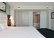 Bedroom with a large bed, closet and bathroom access at 107 S Ocean Blvd. # 704, Myrtle Beach, SC 29577