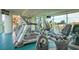 Modern fitness center with treadmills, stationary bikes, and weight machines with floor to ceiling windows at 107 S Ocean Blvd. # 704, Myrtle Beach, SC 29577