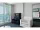 Cozy living room with ocean view balcony, comfortable seating, and entertainment center at 107 S Ocean Blvd. # 704, Myrtle Beach, SC 29577