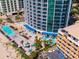 Aerial view of the pools, lounge area, umbrellas, and beachfront near the ocean at 107 S Ocean Blvd. # 704, Myrtle Beach, SC 29577