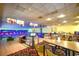 An entertainment center with bowling lanes, seating area and tv monitors at 1105 South Ocean Blvd. # 208, Myrtle Beach, SC 29577