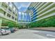 Features solar panel accents, manicured landscaping, and convenient parking on a sunny day at 1105 South Ocean Blvd. # 208, Myrtle Beach, SC 29577