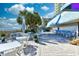 Features an outdoor dining area with tables, chairs and scenic beachfront views and palm trees at 1105 South Ocean Blvd. # 208, Myrtle Beach, SC 29577