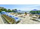 Oceanfront pool deck features lounge chairs, tables, umbrellas and views of the ocean beyond at 1105 South Ocean Blvd. # 208, Myrtle Beach, SC 29577