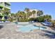 Features a luxurious swimming pool, surrounded by comfortable lounge chairs and lush tropical landscaping at 1105 South Ocean Blvd. # 208, Myrtle Beach, SC 29577