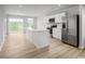 Open-concept kitchen with stainless steel appliances and a large island perfect for entertaining at 1112 Oak Meadow Dr., Conway, SC 29526