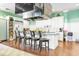 Well-equipped kitchen with stainless steel appliances, a center island with seating, and ample counter space at 1309 Suncrest Dr., Myrtle Beach, SC 29577