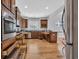 Spacious kitchen features stainless steel appliances, granite countertops, wooden floors, and abundant cabinet space at 1309 Suncrest Dr., Myrtle Beach, SC 29577