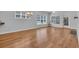 Open-concept space with hardwood floors, large windows, and neutral paint at 1309 Suncrest Dr., Myrtle Beach, SC 29577