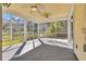 Inviting screened porch with ceiling fans, tile floor and views of the landscaped backyard at 1309 Suncrest Dr., Myrtle Beach, SC 29577
