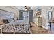 Cozy bedroom with a large bed, stylish dresser, and a view to the outdoor balcony at 1321 S Ocean Blvd. # 510, North Myrtle Beach, SC 29582