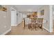 Neutral dining area with tile floors that flow throughout the residence and seating for four at 1321 S Ocean Blvd. # 510, North Myrtle Beach, SC 29582