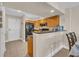 Bright kitchen featuring tile floors, granite counters, wood cabinets and stainless steel appliances at 1321 S Ocean Blvd. # 510, North Myrtle Beach, SC 29582