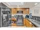 Kitchen with stainless steel appliances, tile floor and wood cabinets for a clean and modern look at 1321 S Ocean Blvd. # 510, North Myrtle Beach, SC 29582