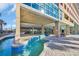 Community lazy river pool with crystal clear water, poolside lounge chairs, and covered seating areas at 1321 S Ocean Blvd. # 510, North Myrtle Beach, SC 29582
