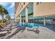 Inviting outdoor pool with lounge chairs alongside a high-rise condo, perfect for relaxation at 1321 S Ocean Blvd. # 510, North Myrtle Beach, SC 29582