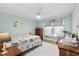 Cozy bedroom with ceiling fan, wood floors, and marine themed décor at 138 Wofford Rd., Conway, SC 29526