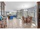 Spacious kitchen and dining area with blue cabinets, stainless steel appliances, and a round wooden table at 138 Wofford Rd., Conway, SC 29526
