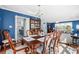 Elegant dining room adjacent to the living room, featuring a chandelier and large table at 138 Wofford Rd., Conway, SC 29526
