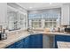 Close up on a kitchen features stainless steel appliances, and blue and white cabinets at 138 Wofford Rd., Conway, SC 29526